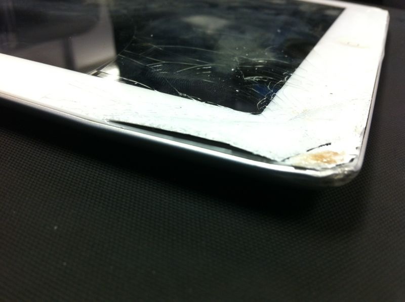 Broken iPad 2 in need of repairs. Bookshelf Victim